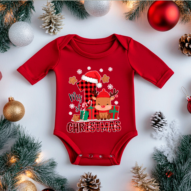 Red baby onesie with Christmas design surrounded by festive decorations on a white background