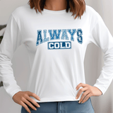 White long-sleeve shirt with 'ALWAYS COLD' text in blue and black worn by a person.