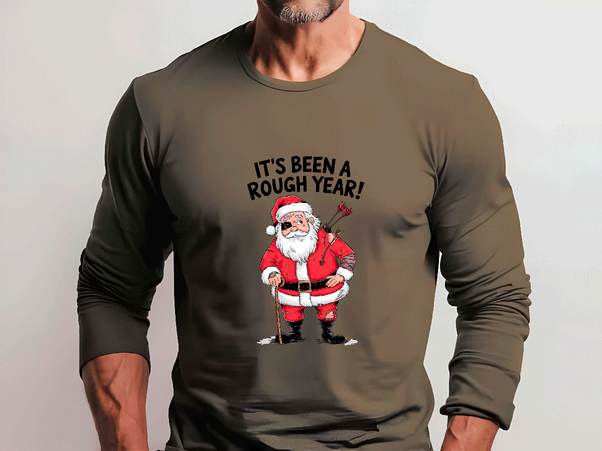 Brown long-sleeve shirt with Santa Claus graphic and text 'It's Been a Rough Year!' on a plain background
