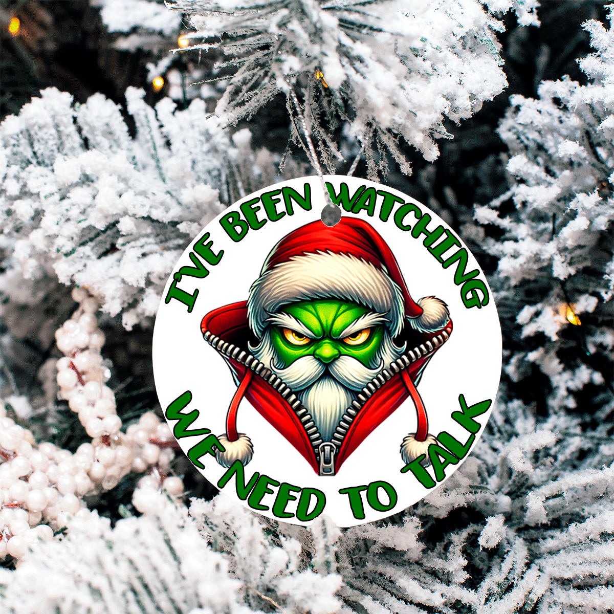 Christmas ornament with a character in a Santa hat and text 'I've been watching. We need to talk' against a snowy tree background.