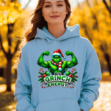 Person wearing a light blue hoodie with a Christmas-themed graphic in an outdoor setting.