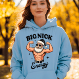 Person wearing a light blue hoodie with a graphic design of a muscular Santa Claus and text 'BIG NICK Energy' in an outdoor setting.