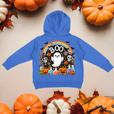 Blue hoodie with Halloween-themed design on a beige background with pumpkins and leaves.