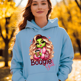 Person wearing a light blue hoodie with a graphic design and text, standing in an outdoor setting with trees.