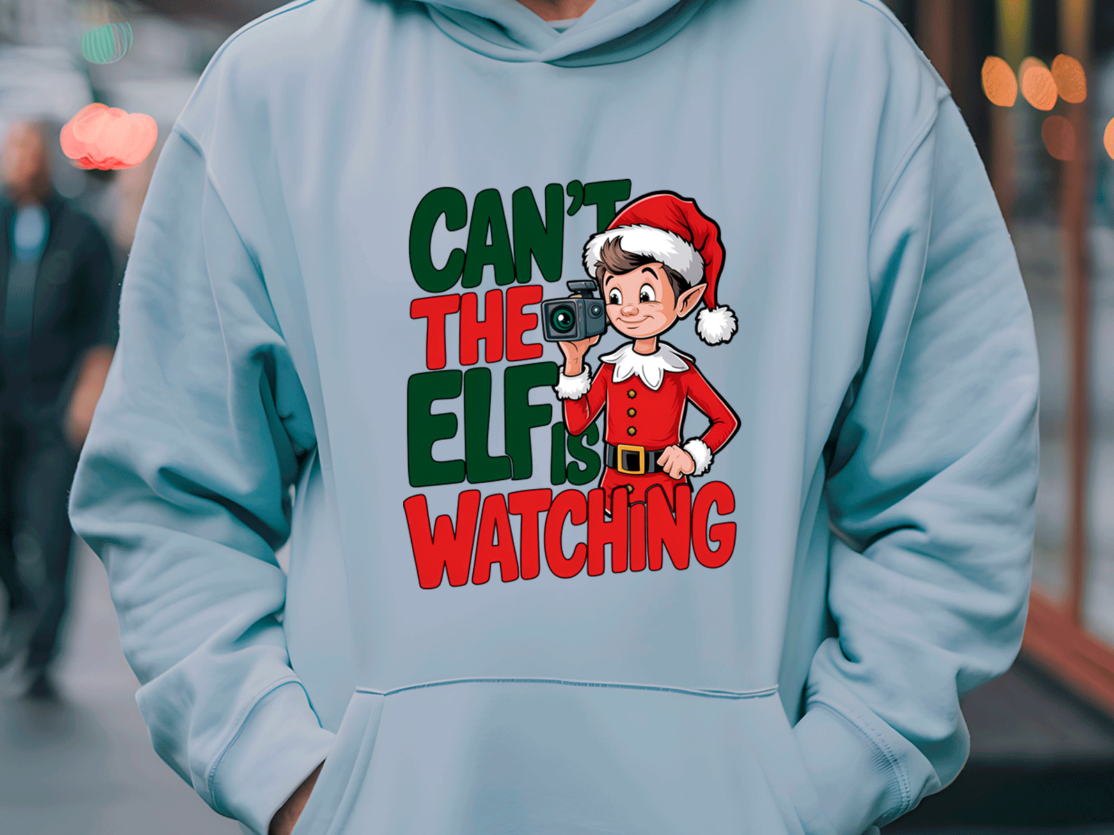 Light blue hoodie with Christmas-themed design featuring an elf and text.