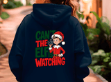 Navy blue hoodie with Christmas-themed design on the back, featuring an elf and text.