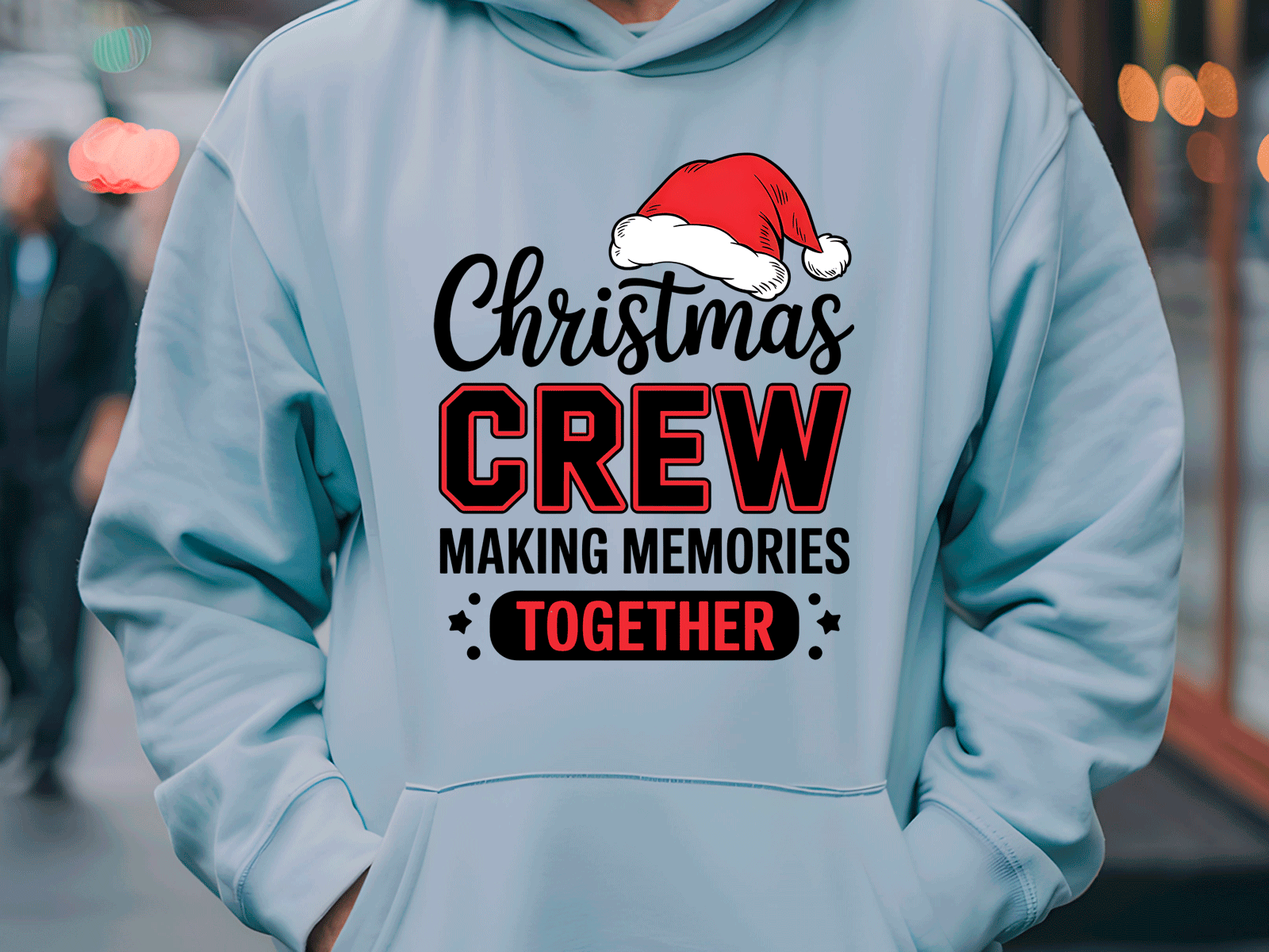 Light blue hoodie with Christmas-themed text and a Santa hat graphic.