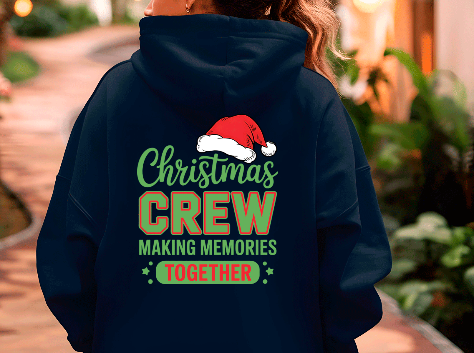 Navy blue hoodie with Christmas-themed text and Santa hat graphic on the back.