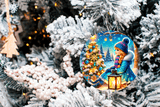 Decorative Christmas ornament with a girl by a tree on a snowy background, hanging on a tree.