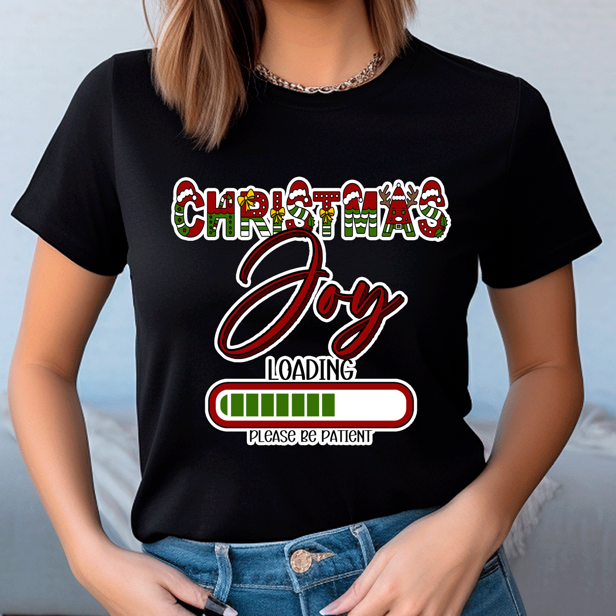 Person wearing a black t-shirt with 'Christmas Joy Loading' text design.