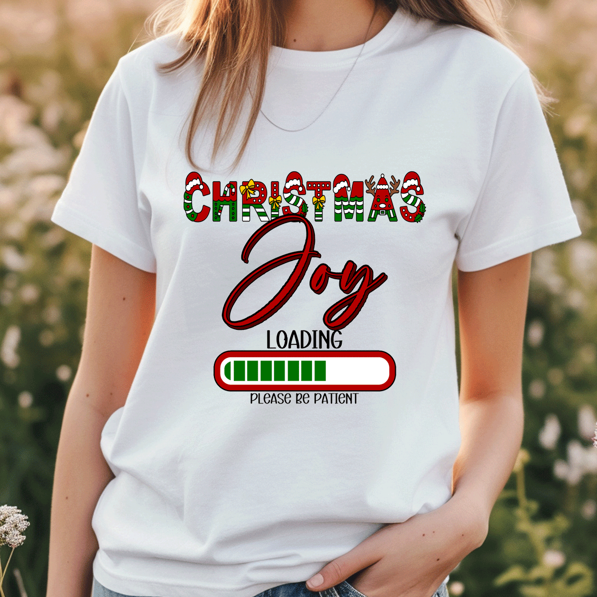 Person wearing a white t-shirt with 'Christmas Joy Loading' text design.