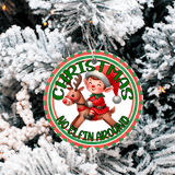 Christmas ornament with an elf and reindeer design hanging on a tree.