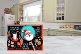 Christmas-themed cutting board  with Santa Claus and reindeer design on a kitchen floor.