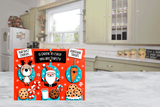 Christmas-themed cutting board  with Santa Claus and reindeer design on a kitchen counter.