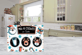 Christmas-themed cutting board  with Santa Claus and reindeer design on a kitchen floor.