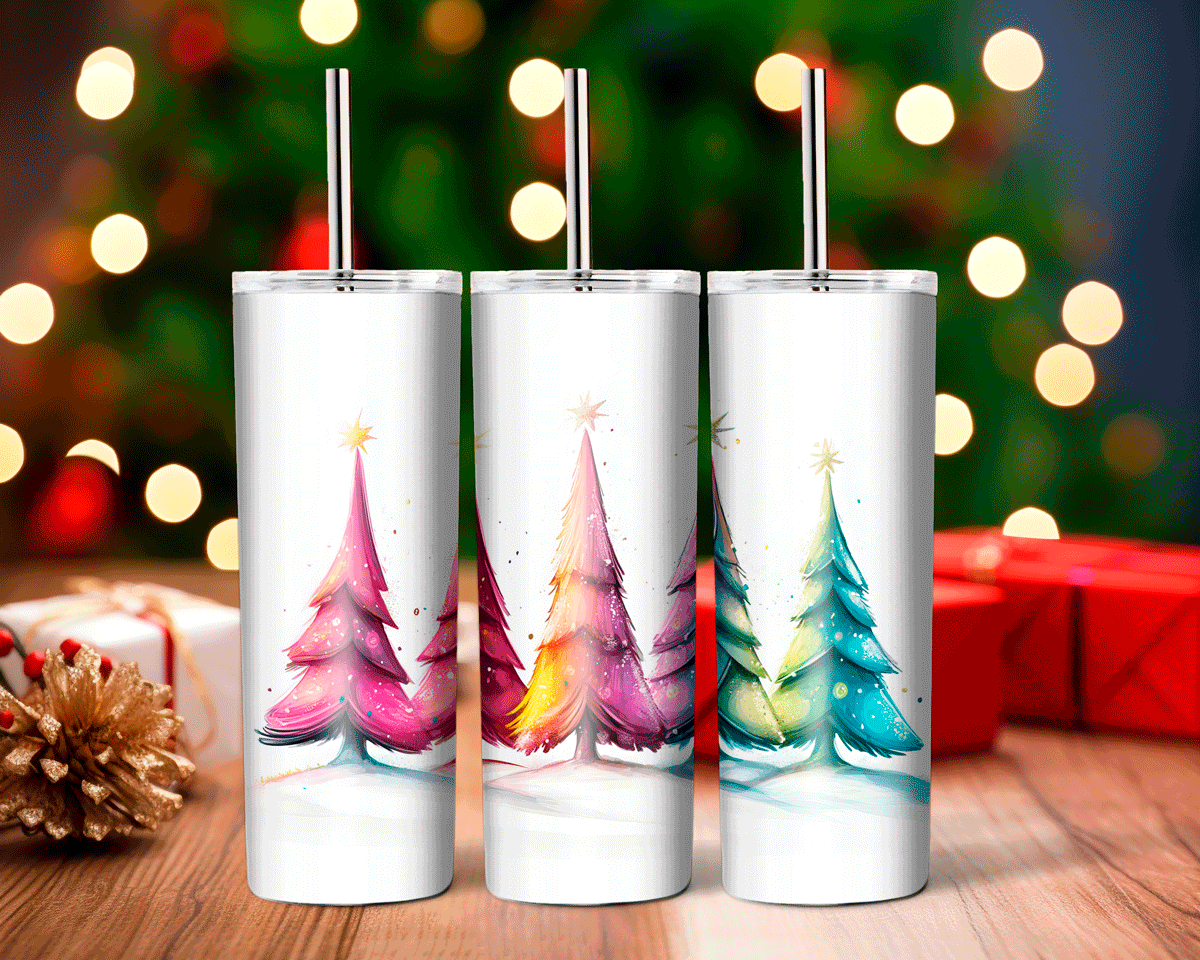 Three white tumblers with Christmas tree designs on a wooden surface with blurred lights and presents in the background.
