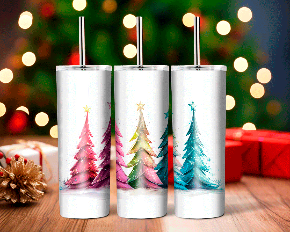 Three white tumblers with Christmas tree designs on a wooden surface with blurred lights and presents in the background.