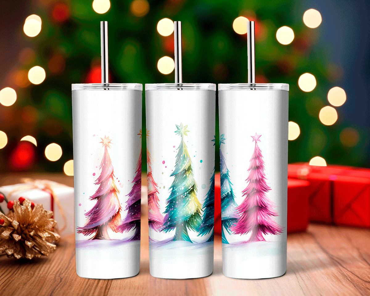 Three white tumblers with Christmas tree designs on a wooden surface with blurred lights and presents in the background.