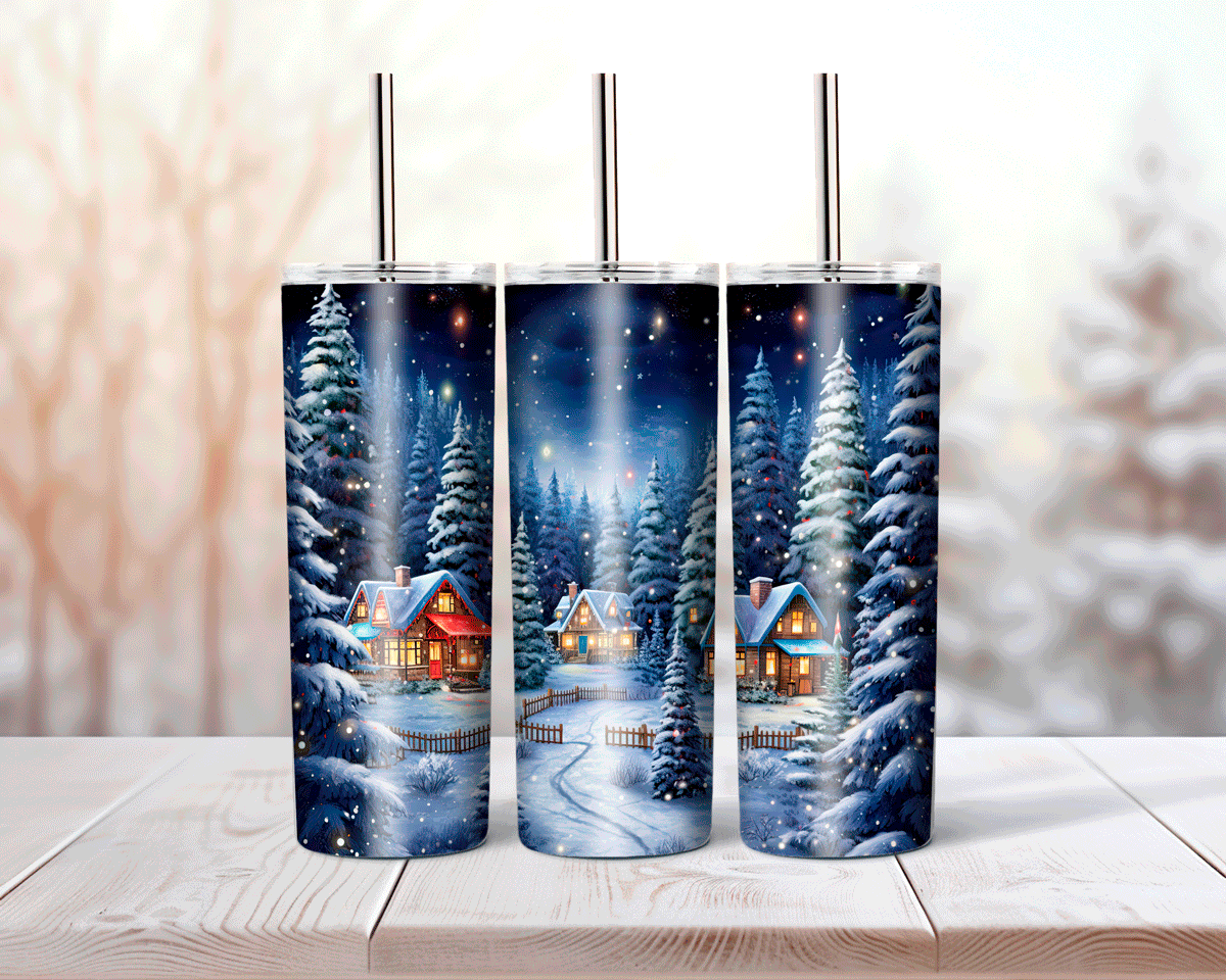 Three tumbler with a winter scene design featuring snow-covered trees and houses.