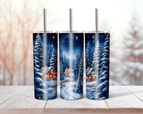 Three tumbler with a winter scene design featuring snow-covered trees and houses.