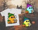 White t-shirt with cartoon character design featuring pumpkins and a moonlit graveyard background