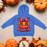 Blue hoodie with a pumpkin design and 'Pumpkin' text, surrounded by pumpkins and leaves on a beige background.
