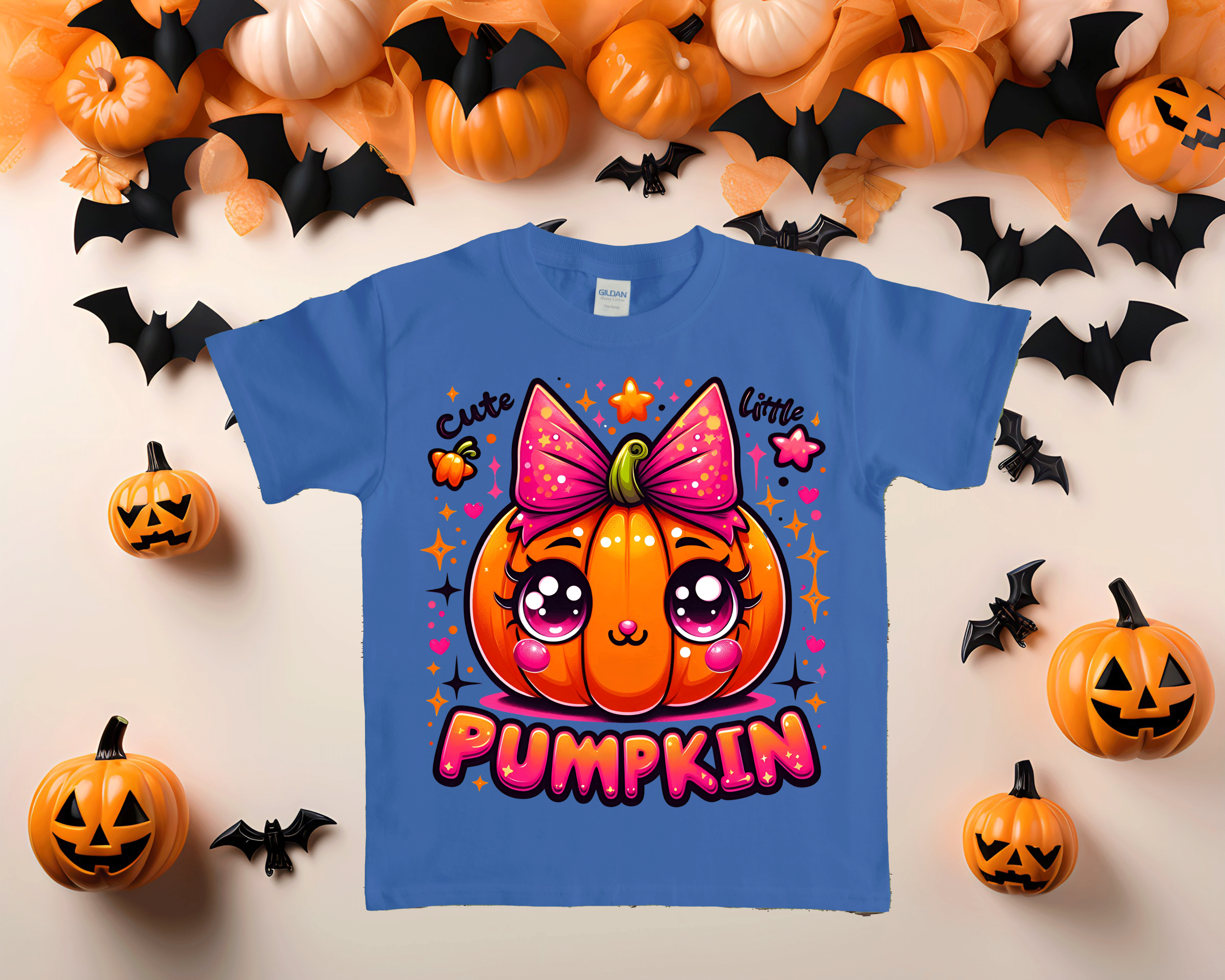 Blue toddler tshirt with pumpkin graphic against an halloween theme background