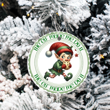 Christmas ornament with an elf design on a snowy tree background