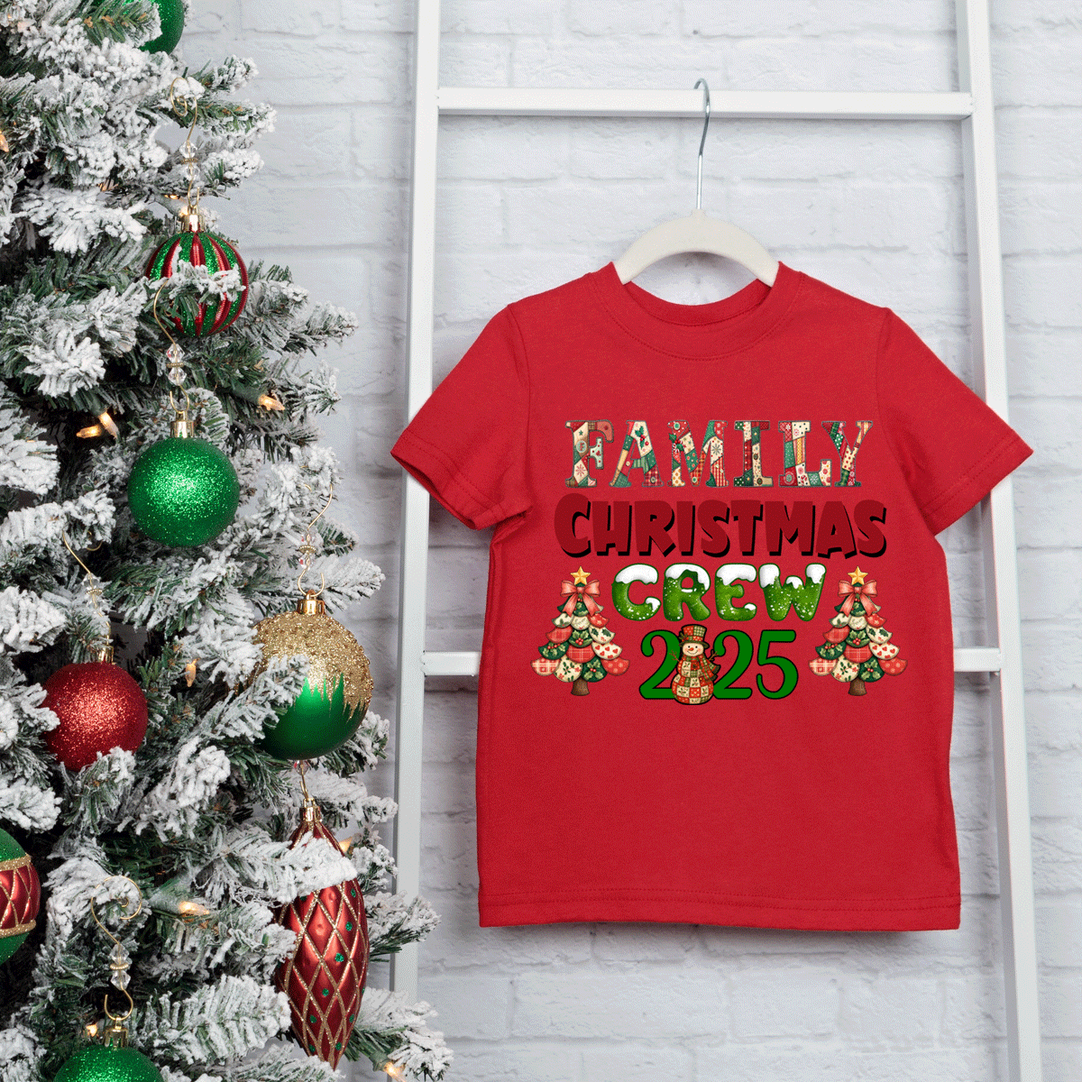 Red t-shirt with 'Family Christmas Crew 2025' text next to a decorated Christmas tree.