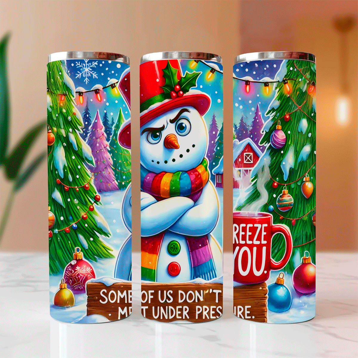 Three Christmas-themed tumblers with a snowman and festive designs on a neutral background.