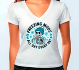 White t-shirt with a skeleton wearing a beanie and scarf graphic and text 'Freezing Mode All Day Every Day' on a white background.