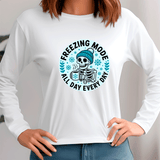 White long-sleeve shirt with a skeleton wearing a beanie and text 'Freezing Mode All Day Every Day' on a plain background.