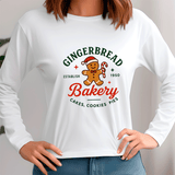 White sweatshirt with gingerbread-themed design featuring a gingerbread man and text.