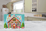 Colorful gingerbread house design on a kitchen counter