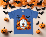 Blue t-shirt with Halloween-themed design featuring a ghost, pumpkins, and bats on a decorative background with pumpkins and bats.