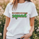 Person wearing a white t-shirt with 'GINGERBREAD SQUAD' text in a field.