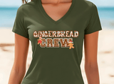 Green t-shirt with 'GINGERBREAD CREW' text and gingerbread men graphics on a beach background