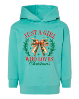 Turquoise hoodie with Christmas-themed design on a white background