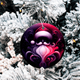 Decorative Christmas ornament with a stylized Santa Claus face on a snow-covered tree.