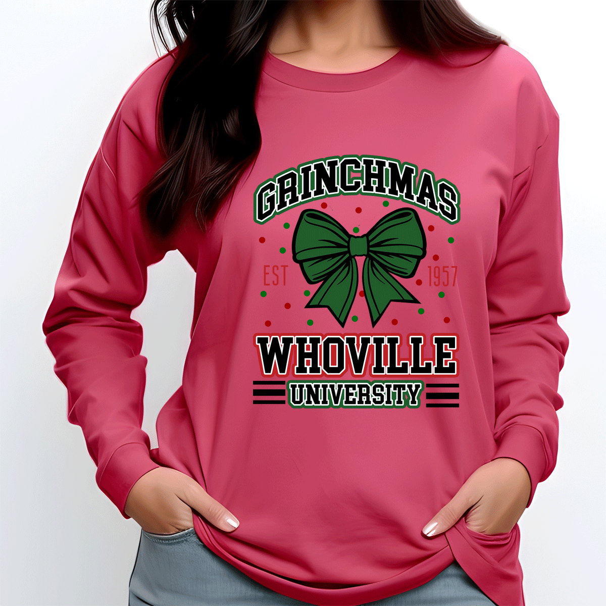 Pink sweatshirt with 'Grinchmas Whoville University' design on a white background