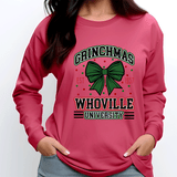Pink sweatshirt with 'Grinchmas Whoville University' design on a white background