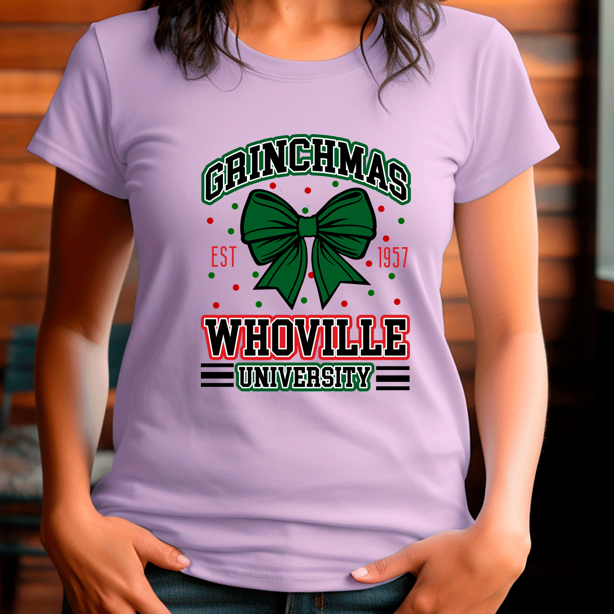 Person wearing a purple t-shirt with 'Grinchmas Whoville University' design.
