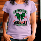 Person wearing a purple t-shirt with 'Grinchmas Whoville University' design.