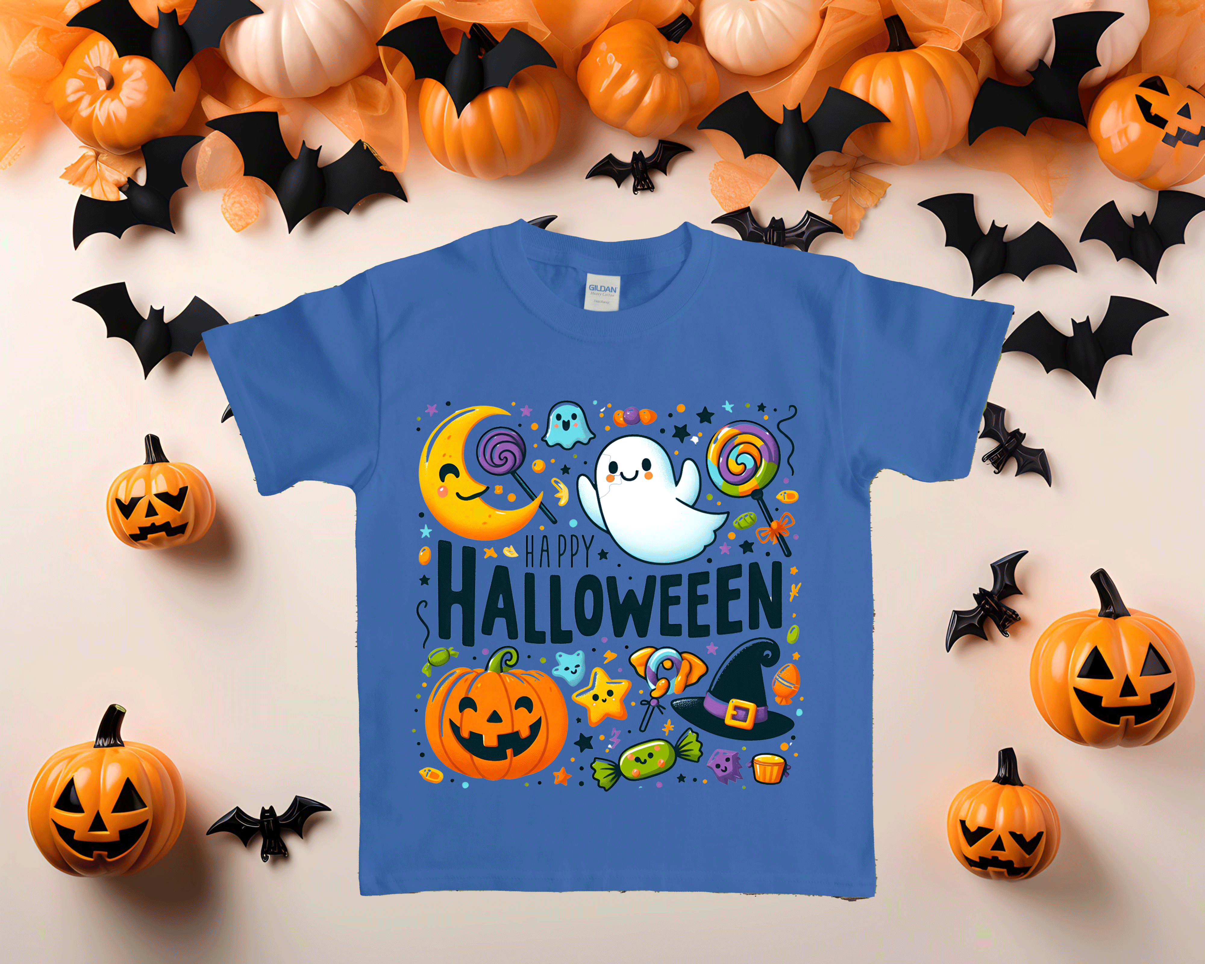 Blue t-shirt with Halloween-themed design surrounded by pumpkins and bats on a light background