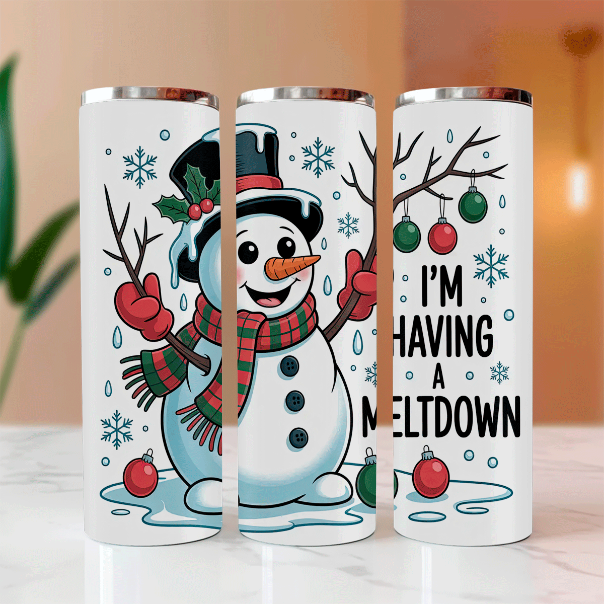 Three white tumblers with Christmas-themed designs featuring a snowman and text.