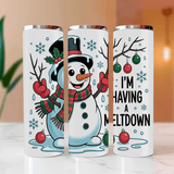 Three white tumblers with Christmas-themed designs featuring a snowman and text.