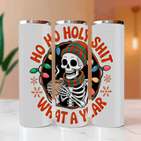 Three white tumblers with a skeleton design and text on a wooden surface.
