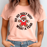 Person wearing a pink t-shirt with a Christmas-themed graphic and text.