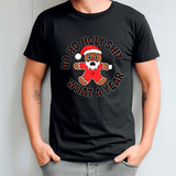 Black t-shirt with a gingerbread man graphic and text on a plain background