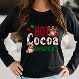 Black long-sleeve shirt with 'Hot Cocoa Season' design featuring a mug and gingerbread men.